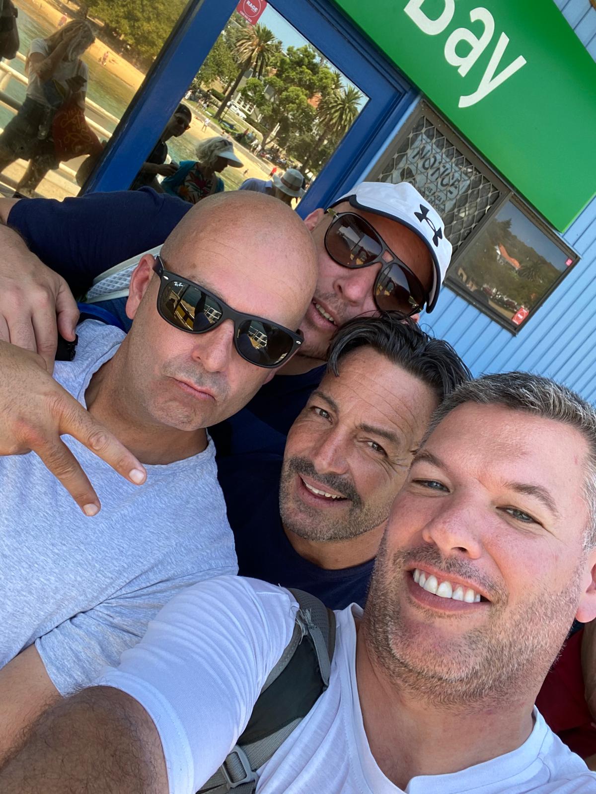 Four blokes selfie at Watsons Bay green sign