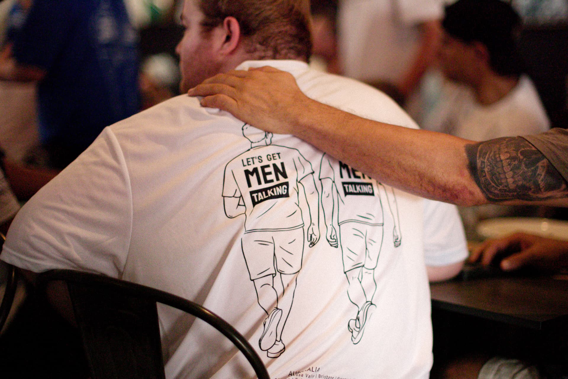 Two supporters clasping hands at a Spoke to a Bloke walk